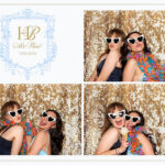 Wedding guests posing in photo booth at Kendall Point wedding venue