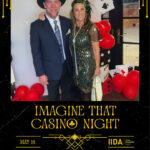 Guests enjoying roaming photo booth photos at IIDA Casino Night