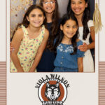 Students enjoying graduation event photo booth experience