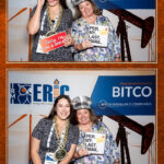 Guests enjoying a custom photo booth experience during the IRMI Conference.
