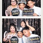 Fun group photo inside the Peek A Booth at Tam and Sean's wedding reception at Canyon Springs Golf Club.