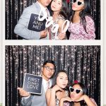 Guests enjoying the wedding photo booth experience at Tam and Sean's elegant San Antonio celebration.
