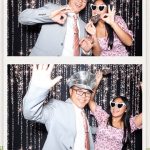 Friends and family capturing memorable photo booth pictures at Canyon Springs Golf Club wedding.