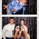 Wedding guests posing with fun props during Tam and Sean's San Antonio wedding reception.