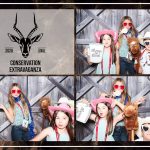 Exotic Wildlife Association guests posing at a photo booth in San Antonio.
