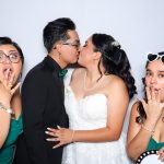 Guests enjoying the photo booth at Chelsey and Adam’s wedding at Cana Ballroom in Boerne, Texas.