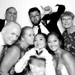 Guests posing for photos at a Gardens of Cranesbury View wedding reception.