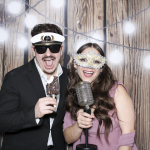 Guests posing for photos during a surprise wedding reception at The Ivy.